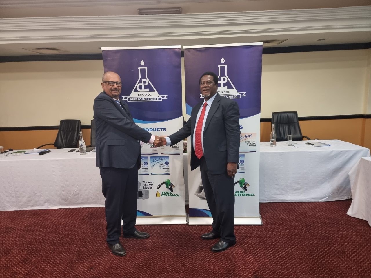 Mwadiwa-right-shakes-hands-with-Patel-to-signfy-the-agreement-1280x960.jpg